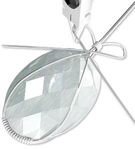 pliers shaping wire around cabochon